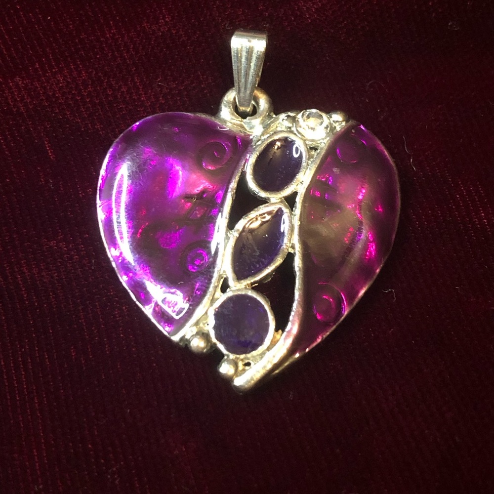 Purple Heart, silver tone three smaller stones and two larger. Pendent